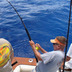 Dad reeling the rod